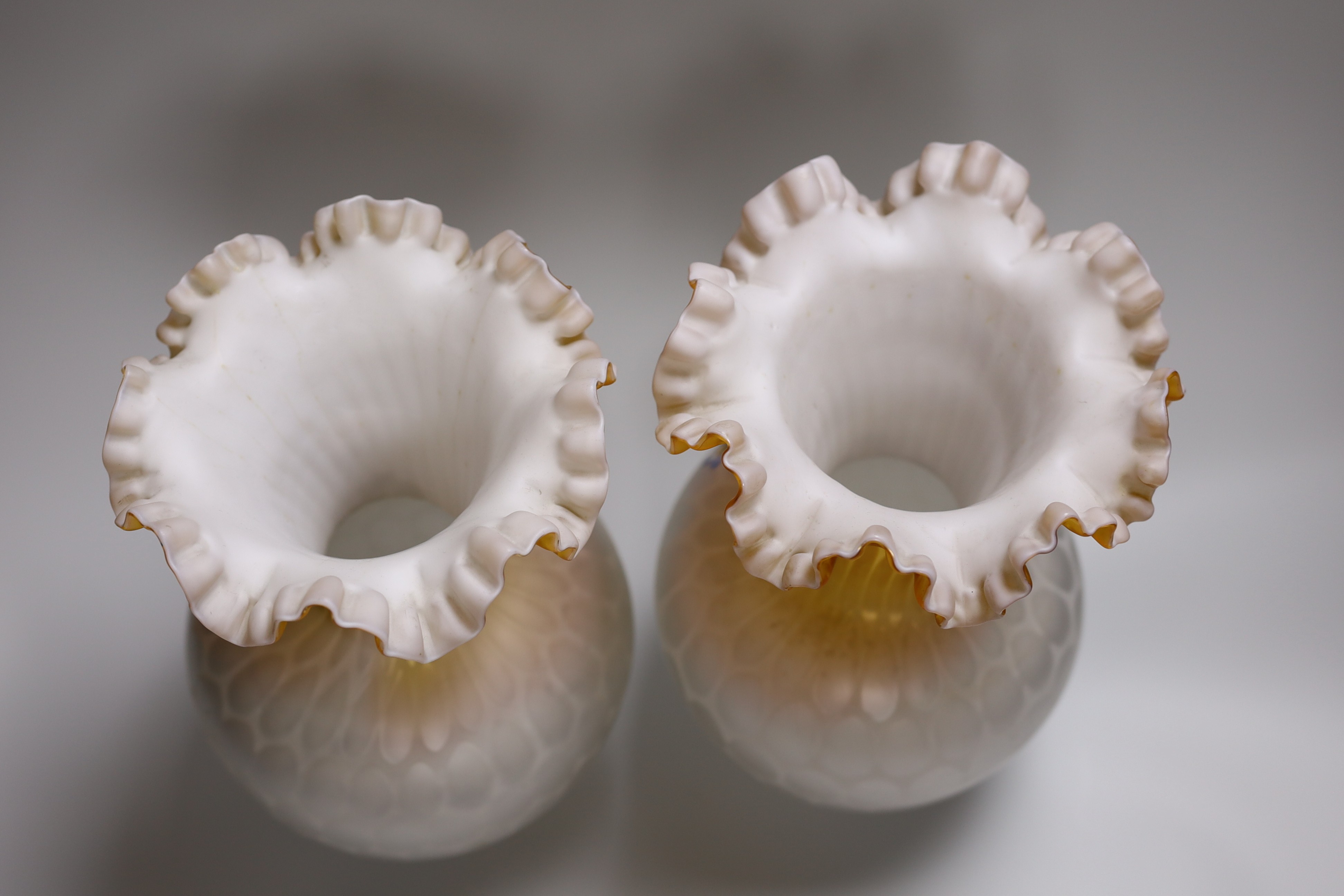 A pair of late 19th century quilted satin glass vases, 29.5cm high